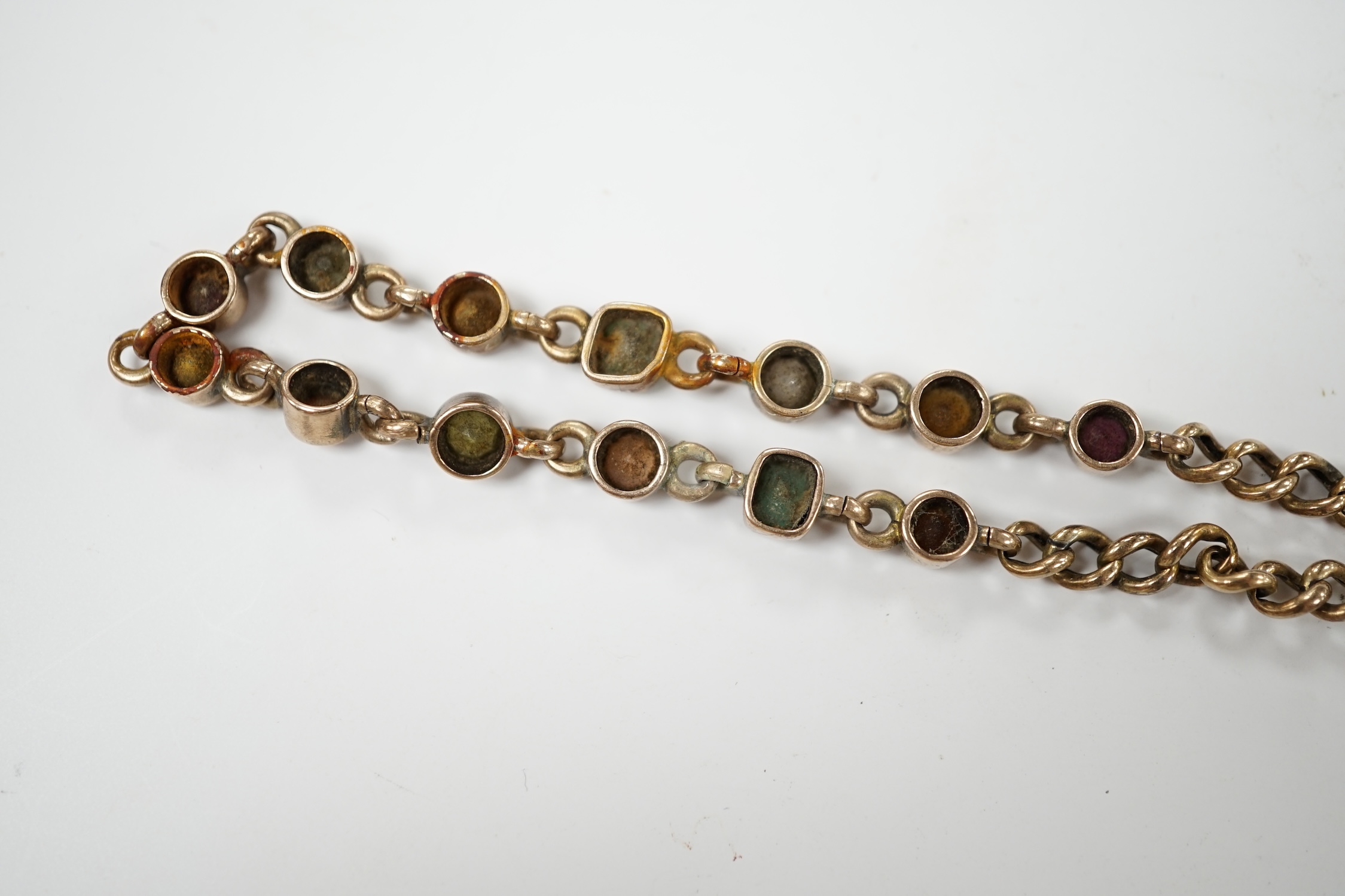 An early 20th century yellow metal and multi gem set bracelet, 19cm, gross weight 10.6 grams. Condition - poor